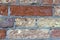 high res of a pale, rough, grunge multi earth tone horizontal brick wall close up texture background