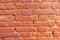 high res of a vibrant, rough, grunge orange multi tone horizontal brick wall close up texture background