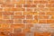 high res of a vibrant, semi smooth orange multi tone horizontal brick wall close up texture background