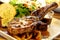 High resolution grilled `kuro buta`pork ribs and black pepper sauce served with potato wedges,bread and salad