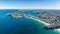 High resolution panoramic high angle drone view of Manly Beach, North Head and the Sydney Harbour area.