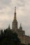 The High-rise building on the Barrikadnaya Metro subway station of Moscow on the summer sunlight on the grey sky on warm tones