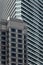 High-rise building facade with glass ans steel near Petronas twin towers in Kuala Lumpur, Malaysia