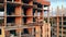 High-rise building in progress with engineers standing in it