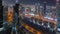 High-rise buildings on Sheikh Zayed Road in Dubai aerial night timelapse, UAE.