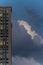 High-rise condominiums against dramatic sky