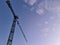 High-rise crane for construction on sky background