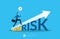 High risk high return concept. Confident smart businessman investor running on grow up stock market graph above word Risk