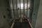 High risk solitary confinement cell in prison through bars