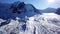 High rocks covered with snow. The Tuyuk Su Glacier