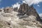 High rocky peaks of Pale di San Martino, in Italian Dolomites with dramatic deep blue sky on sunny day