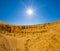 High sandy desert dune in light of sparkle sun