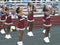 High school cheerleaders at a foorball game in