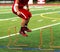 High School Football player jumping over mini hurdles