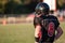 A high school football player looks over the field before the game starts