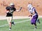 High School Football Player Running with the Ball During a Game