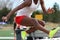 High school girl high above a hurdle during a track race