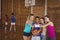 High school girls taking a selfie in basketball court