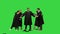 High school graduates tossing up hats on a Green Screen, Chroma Key.