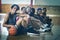 High school kids sitting on the floor in basketball court indoors