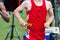 High school runner racing a relay with a baton