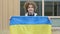 High school student hold the flag of Ukraine.