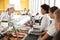 High School Students Wearing Uniform Being Served Food In Canteen