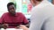 High School Tutor Gives Male Student One To One Tuition At Desk