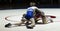 High school wrestlers wrestling onder a spot light in a gym