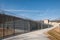 high-security nuclear waste storage facility with perimeter fence and security cameras