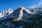 High sharp rocks and forest. Mountain valley before sunset. Natural landscape. Landscape in autumn time.