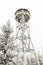 High, snow-covered lookout tower on the top of the Jagodna mountain, winter season