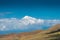 High snowy mountain Ararat behind the clouds on a sunny day, beautiful landscape
