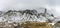 High snowy rocks hidden in a mist