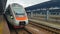 The high-speed passenger electric train Hyundai Rotem Tarpan HRCS2 Intercity stands on the platform of the central railway station