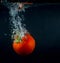 High speed photography tomato splash in water over black