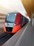 High-speed red passenger train passes the railway platform