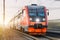 High-speed red passenger train rushing through the railway in the evening at sunset.