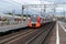 High-speed train arrives to railway station to pick up passengers to reach destination on nasty day