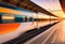 High speed train in motion on the railway station at sunset