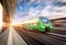 High speed train in motion at the railway station at sunset