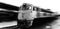 High-speed train passing station with motion blur old loco motive black and white photography