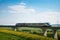 high-speed train roars past bridge, with view of the countryside visible through the windows