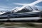 high-speed train zooming past mountain range, with snowcapped peaks in the background