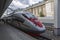 High speed trains `Sapsan`  near platform the Leningrad railway station in Moscow, the conductor checks the ticket of the passen