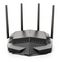 High speed wireless wi-fi black router, modem or range extender with four antennas isolated on white. 3D illustration