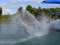 High splashing water after a swimmer has jumped from a sail yaacht into the water and dived