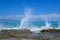 High splashing waves breaking on a stone, Chrissi Island, Greece