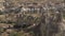 High steep cone rocks cast shadows in Cappadocia valley