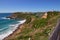 High steep ocean coast in summer day